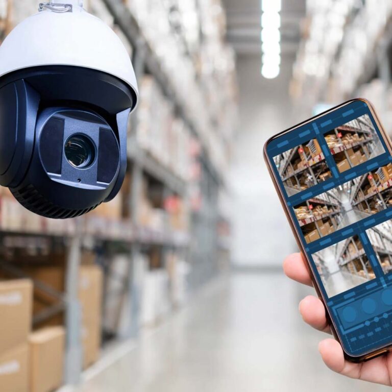 Technician installing a security camera system at a commercial property in Colorado Title: Security Camera Installation in Colorado